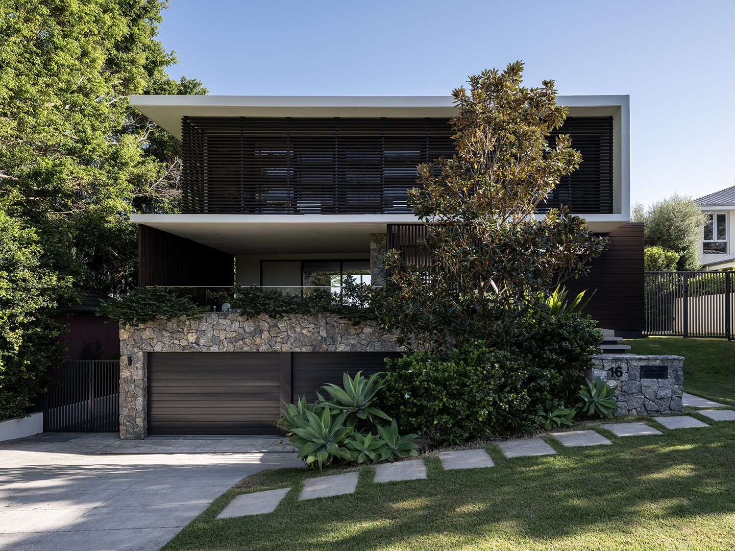 Amaroo — front facade, timber battens and stone base