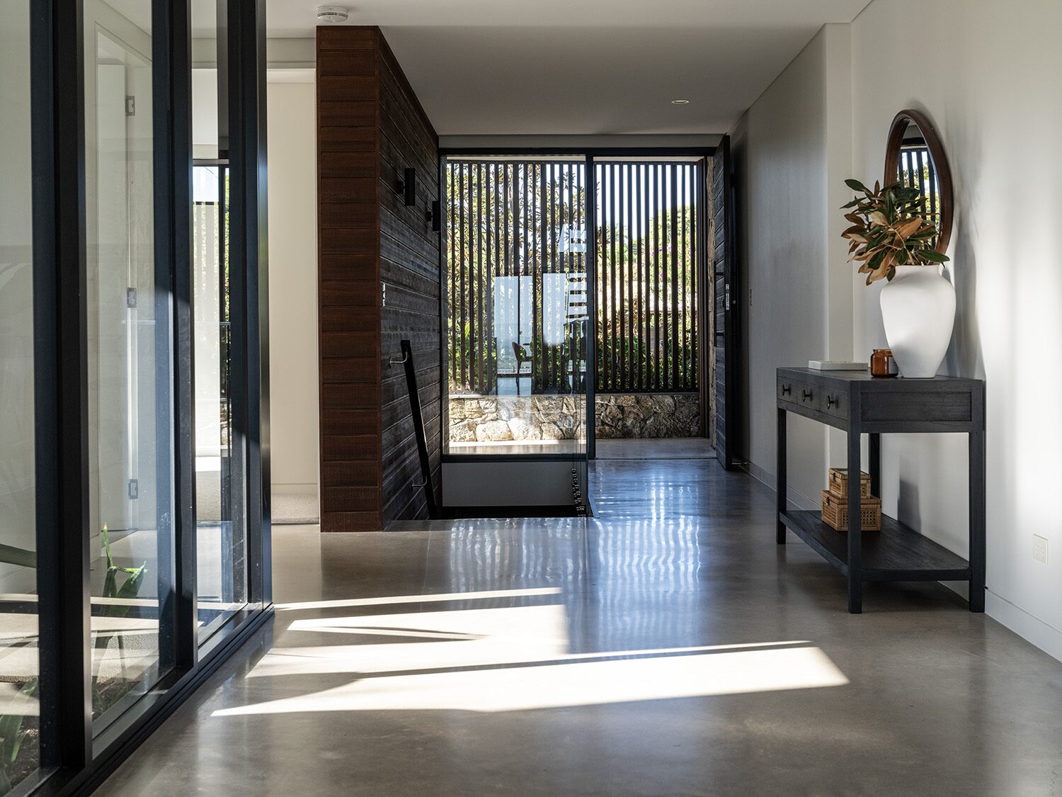 Amaroo — entry hall, staircase and stone wall