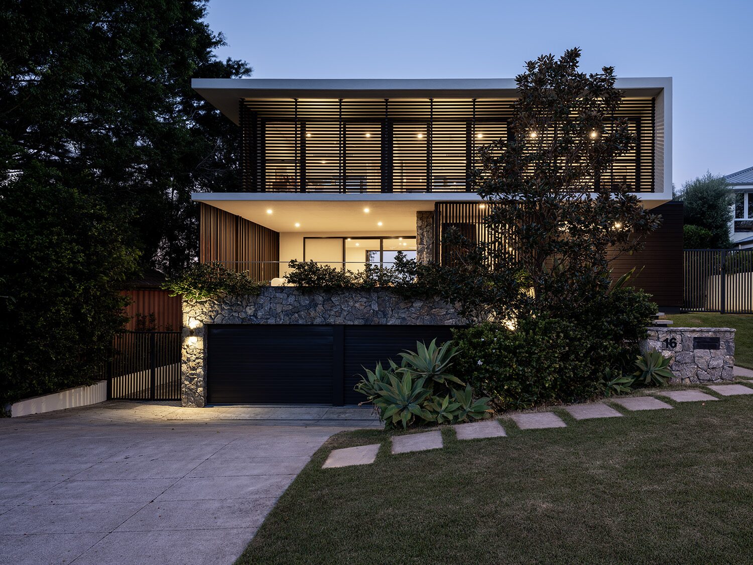 Amaroo — front facade at dusk, 16 address plaque
