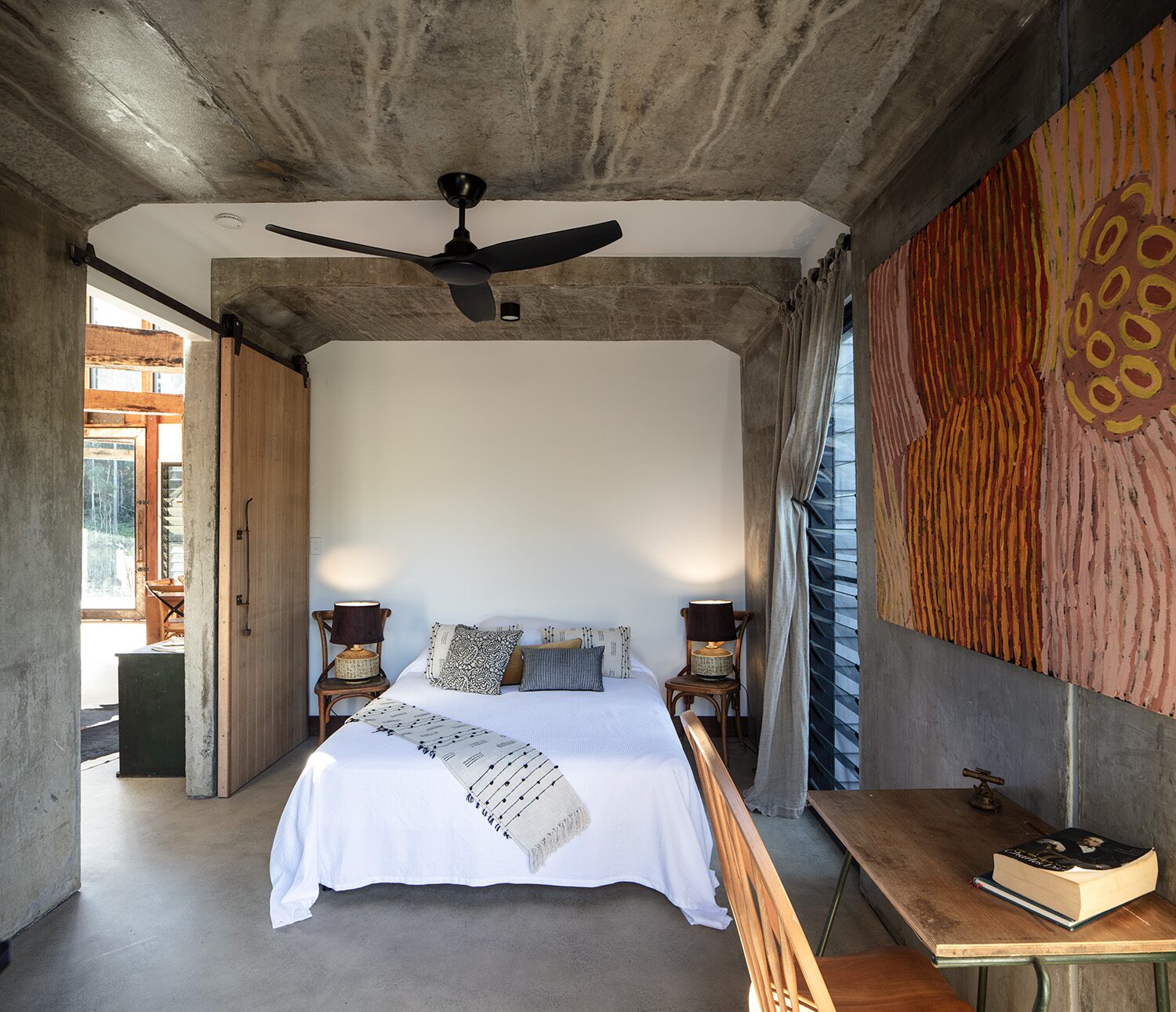 Arrowwood Acres — bedroom, wood stove and barn door
