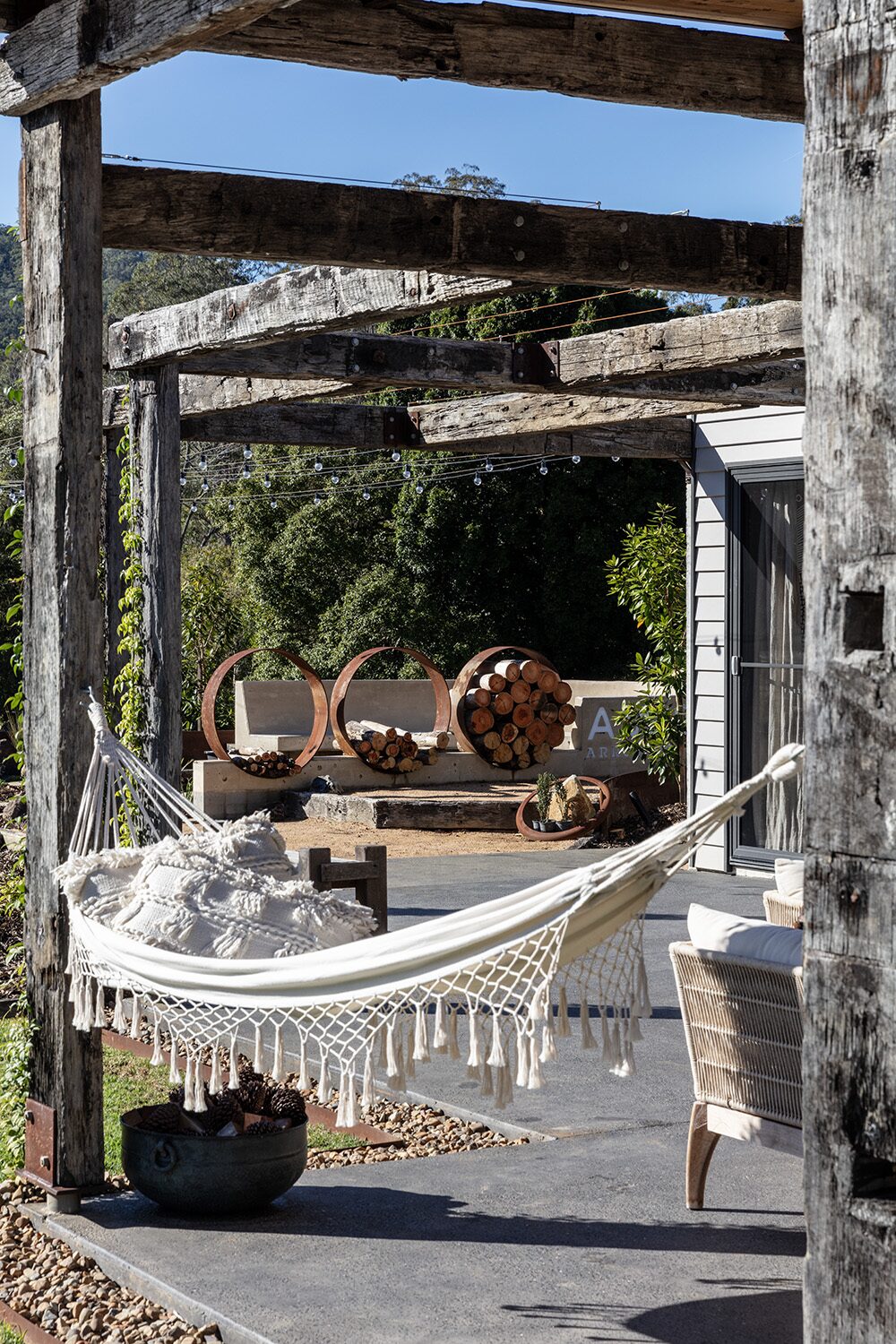 Arrowwood Acres — veranda hammock, fire-pit sculpture