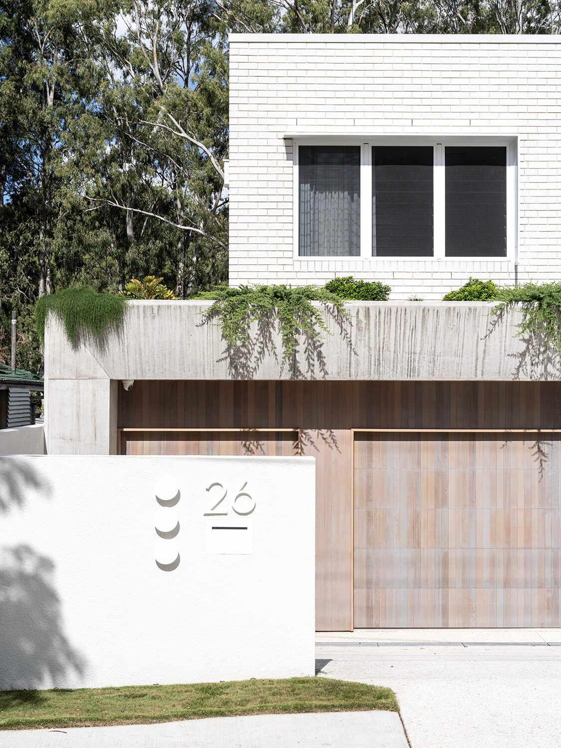 Canopus 2.0 — front facade detail, 26 address plaque