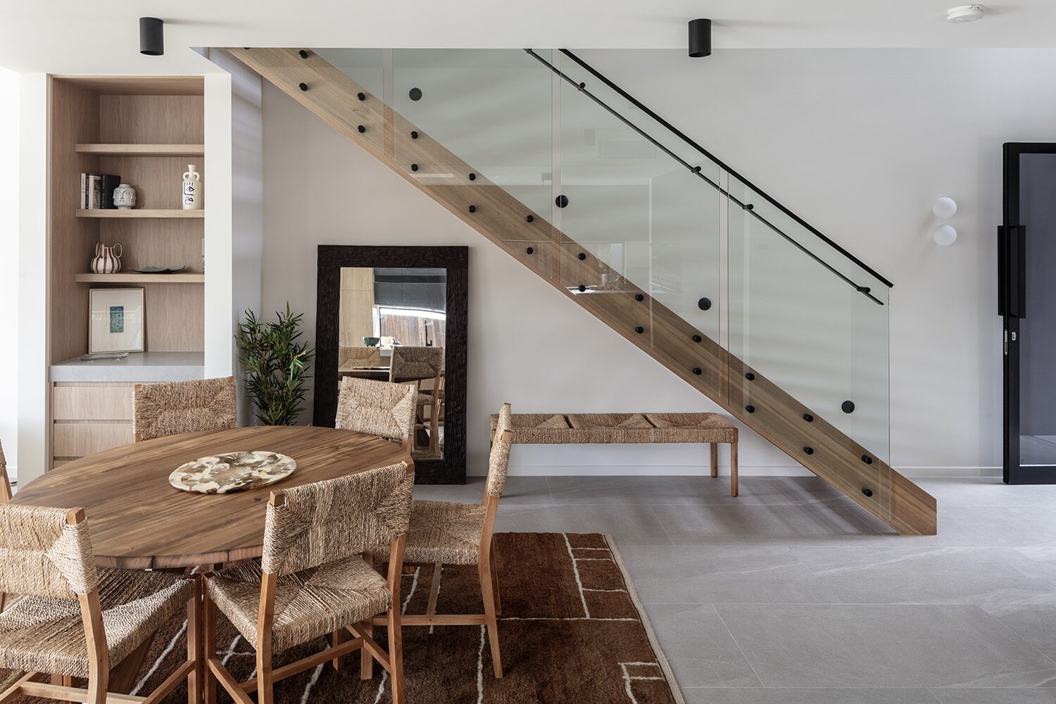 Delorme — dining area, timber-slat staircase
