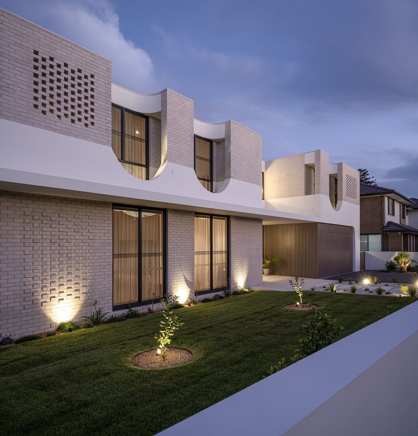Miranda — dusk exterior, angled facade