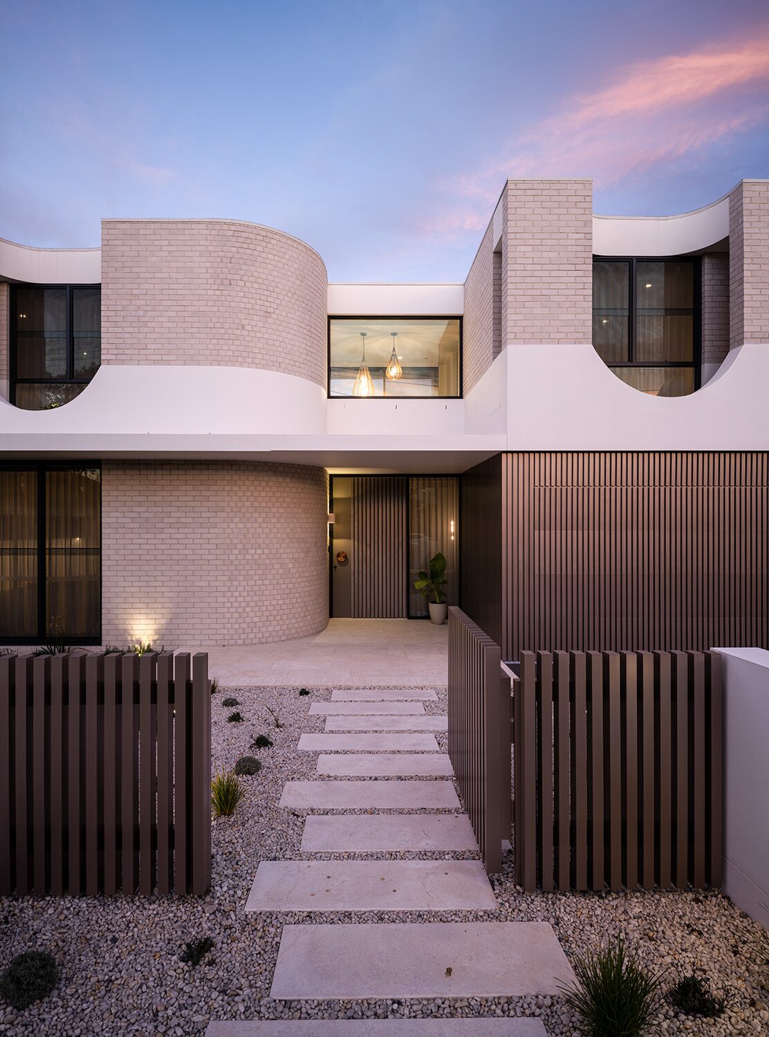 Miranda — dusk exterior, entry path
