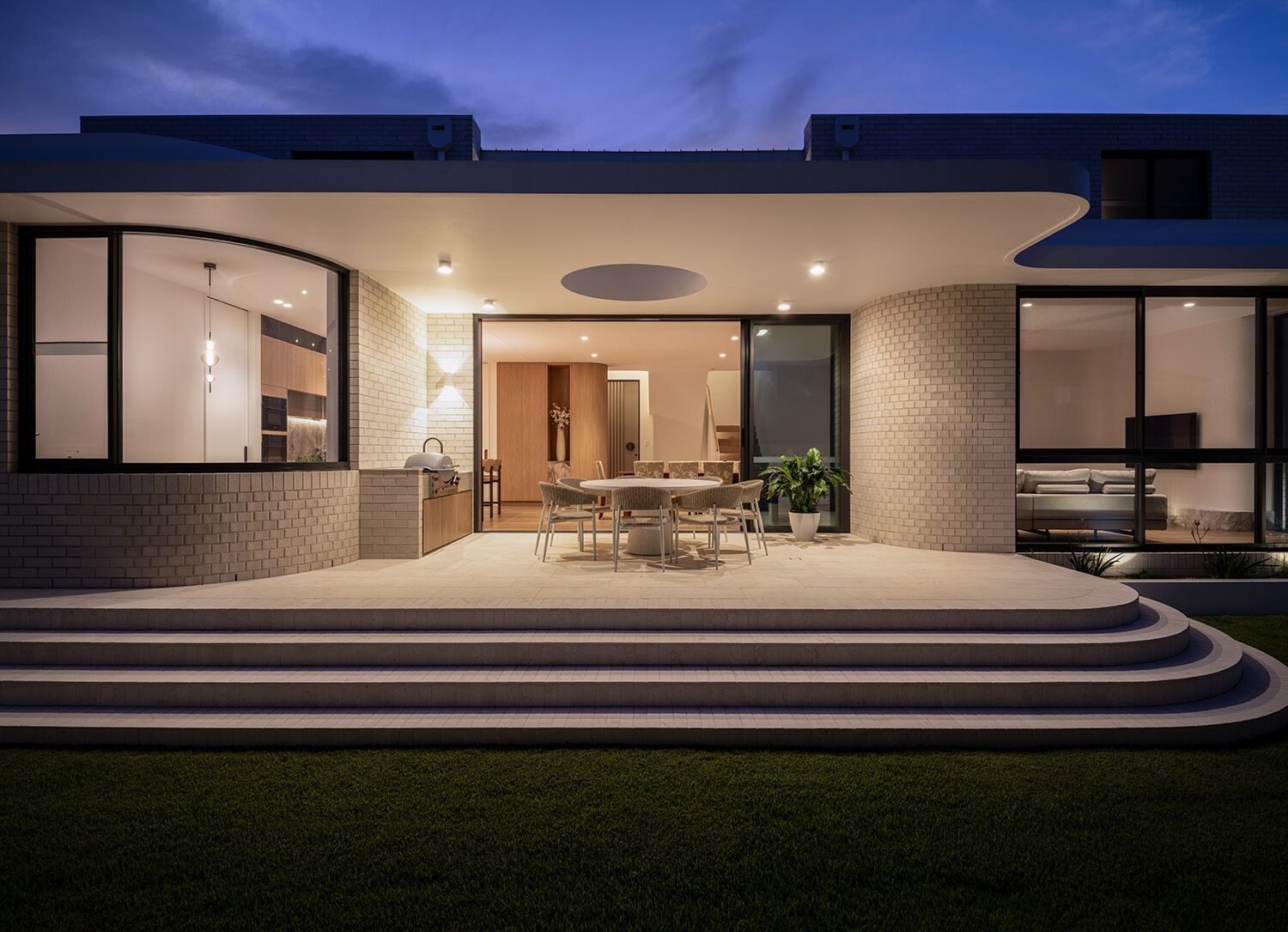 Miranda — dusk exterior, wide