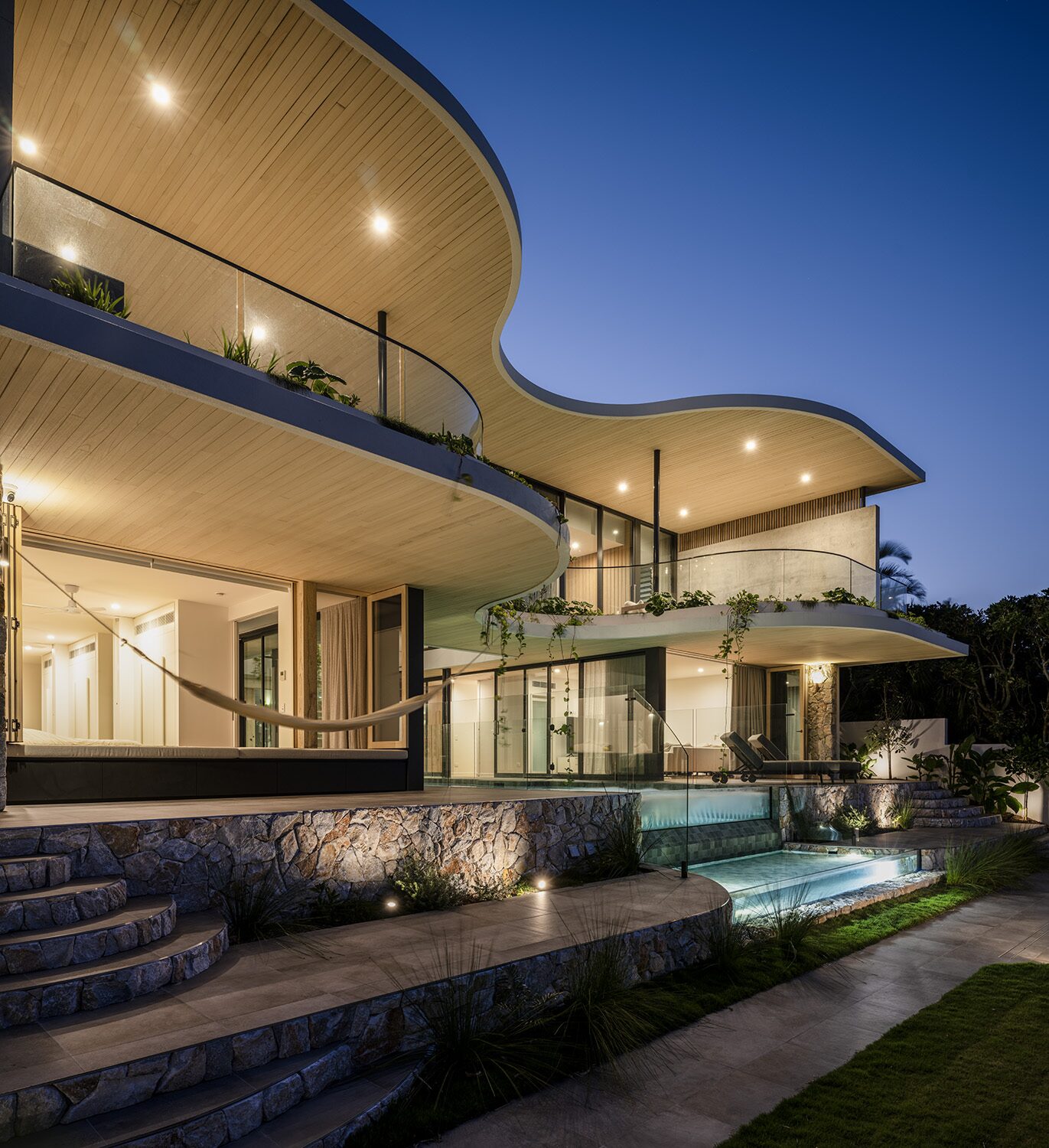 Netherby Rise — dusk exterior, pool lit