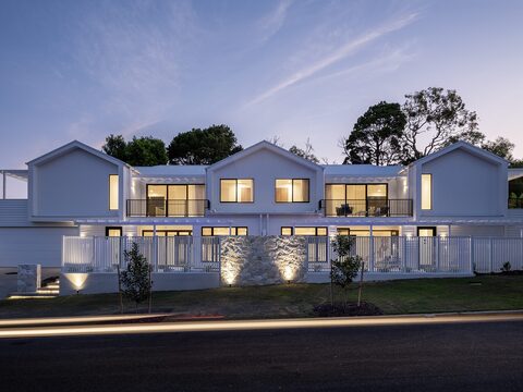 Noosaville, front facade at dusk — designed and built by QLDBuilt