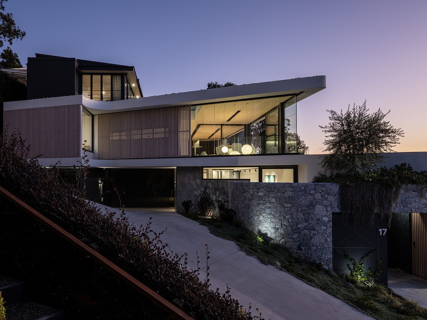 Pacific Heights — facade at dusk, rooftop pool glowing