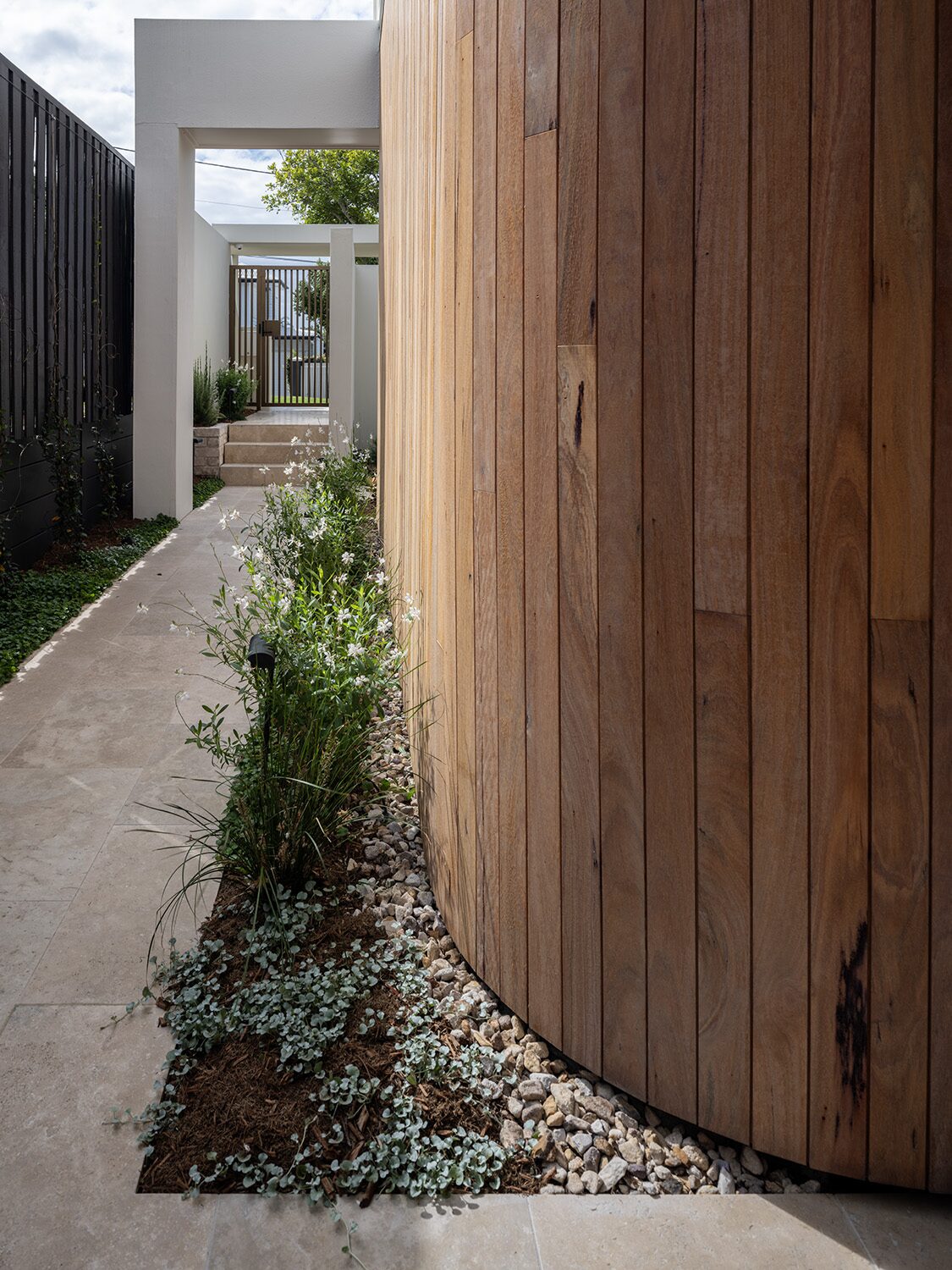Pelham — curved timber-clad wall