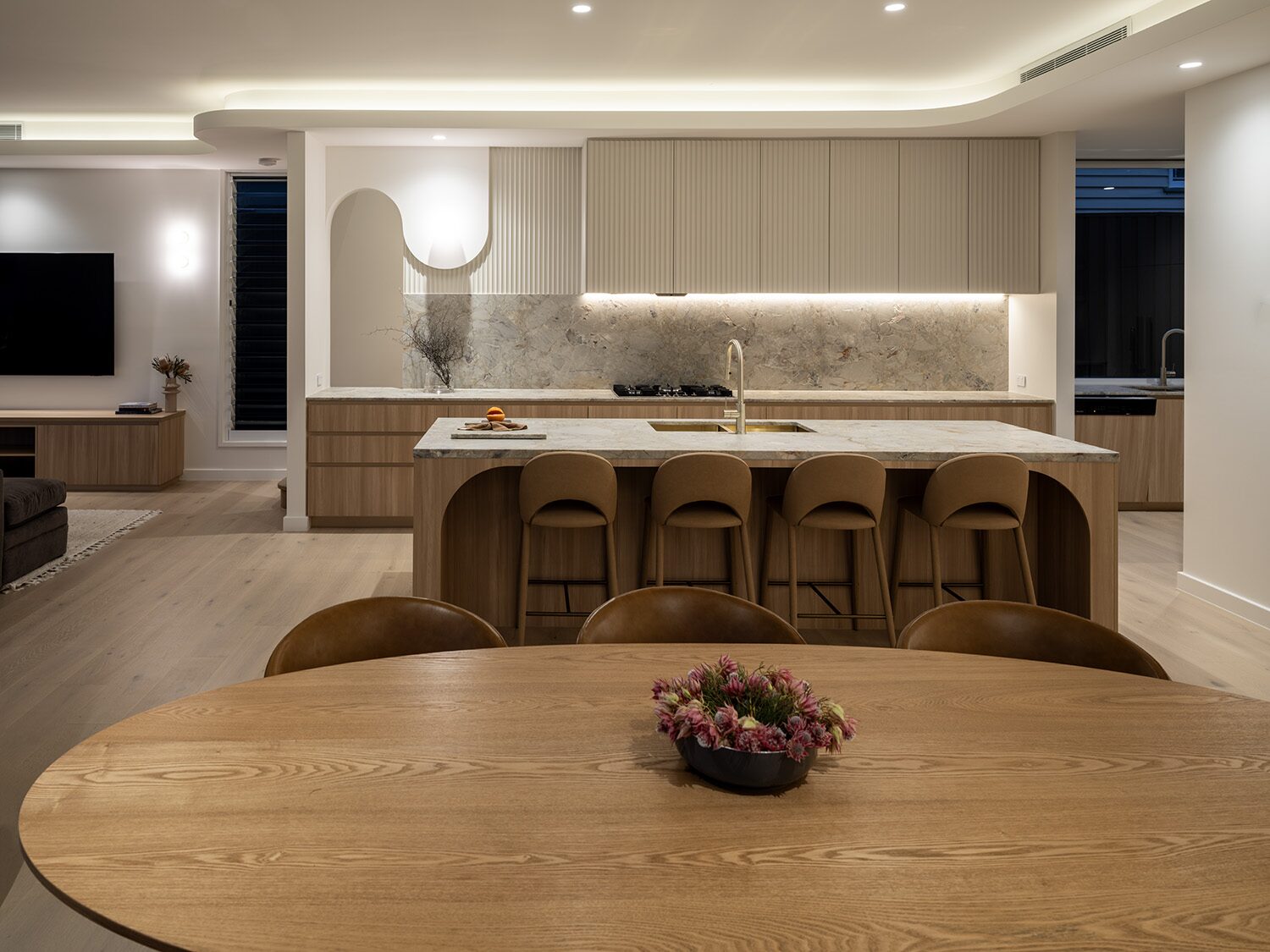 Pelham — kitchen and dining, wide view at dusk
