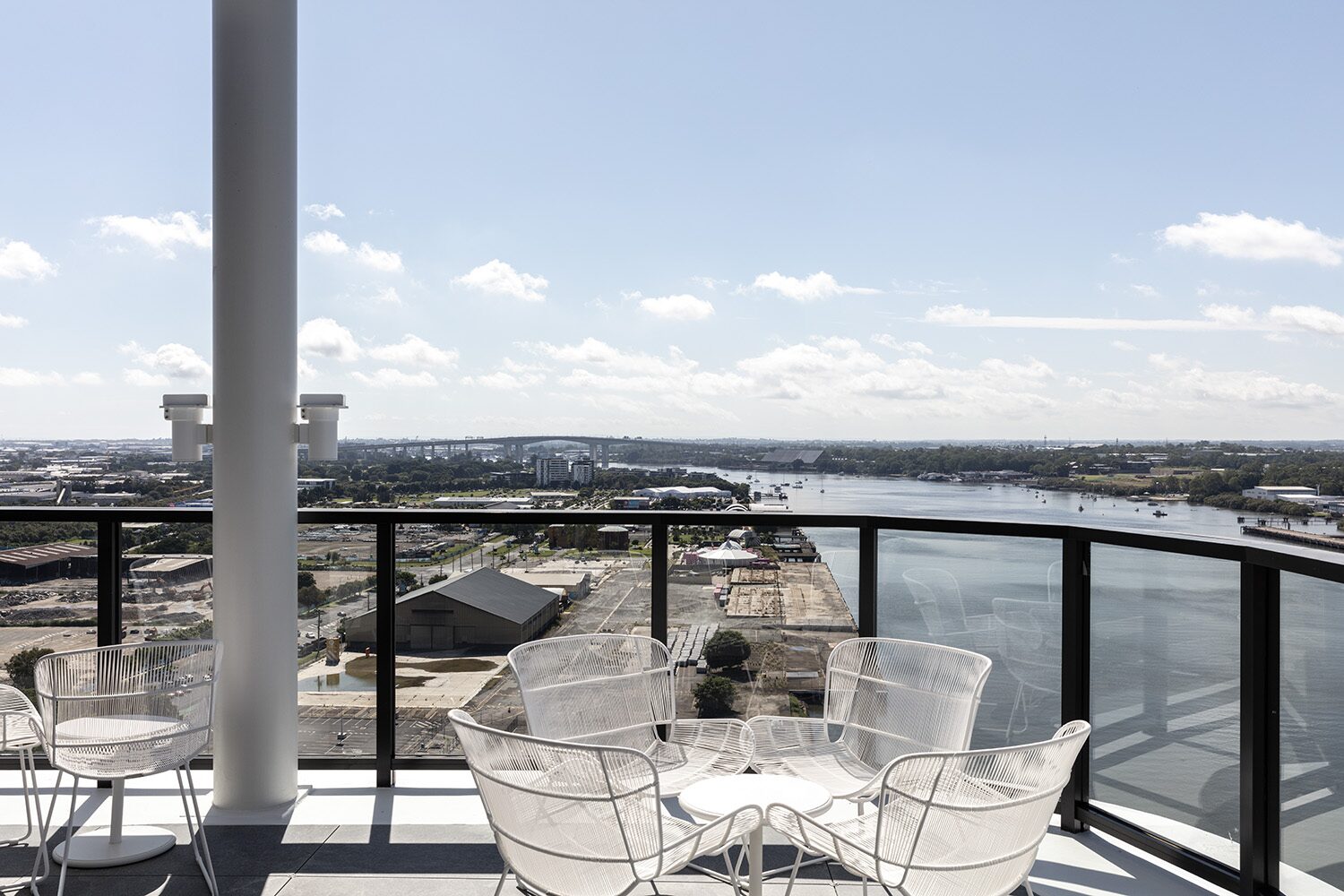 Rivello Residences — resident balcony, seating and river view