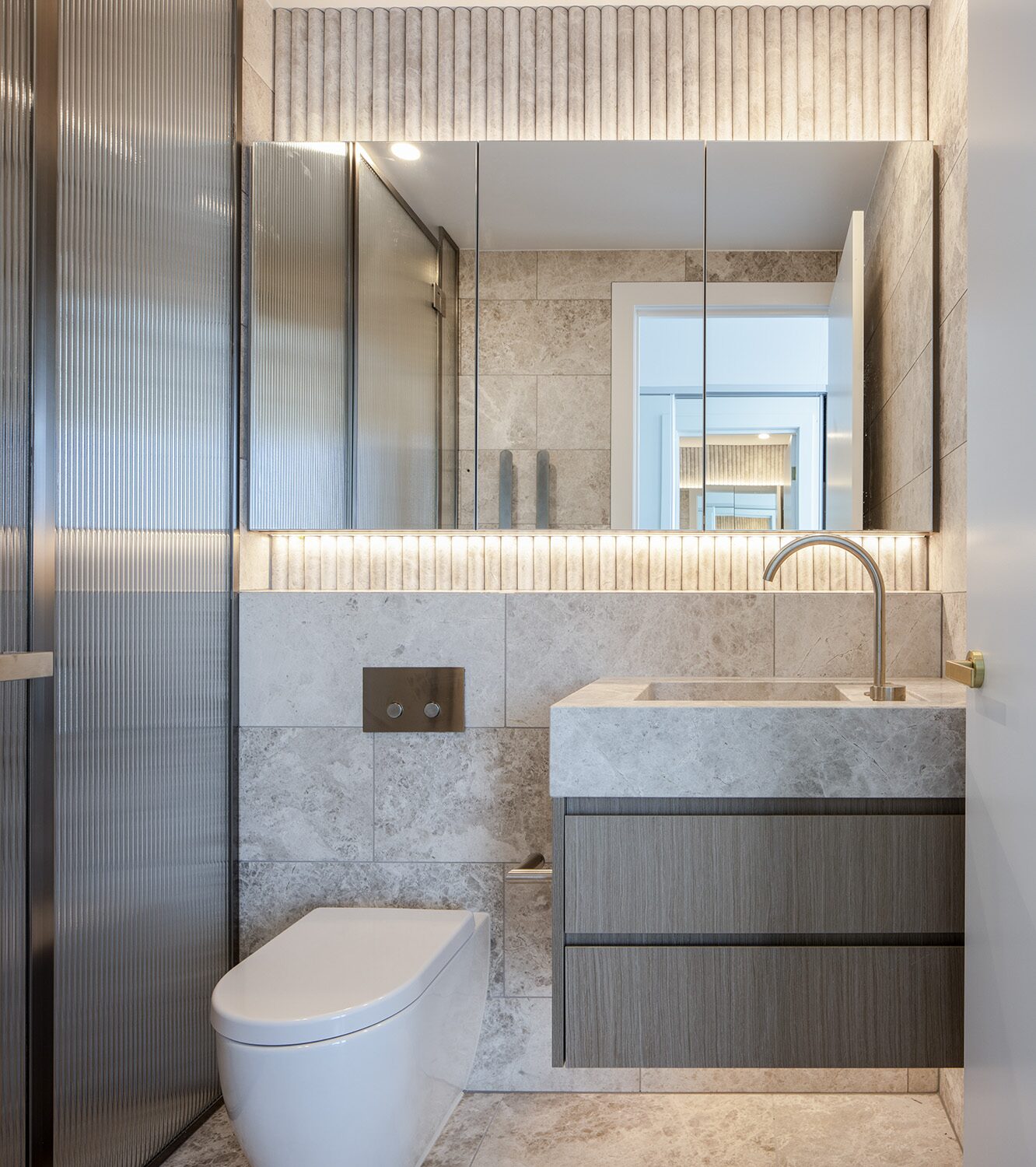 Rivello Residences — powder room, vanity and mirrored cabinetry
