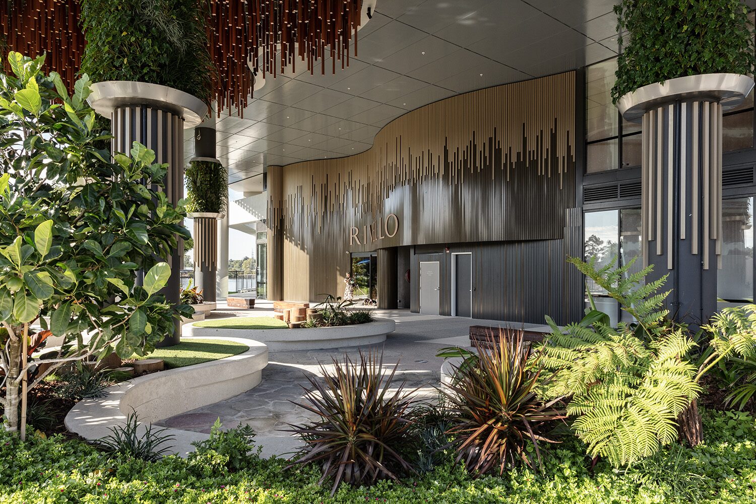 Rivello Residences — entrance, landscaped garden and river beyond