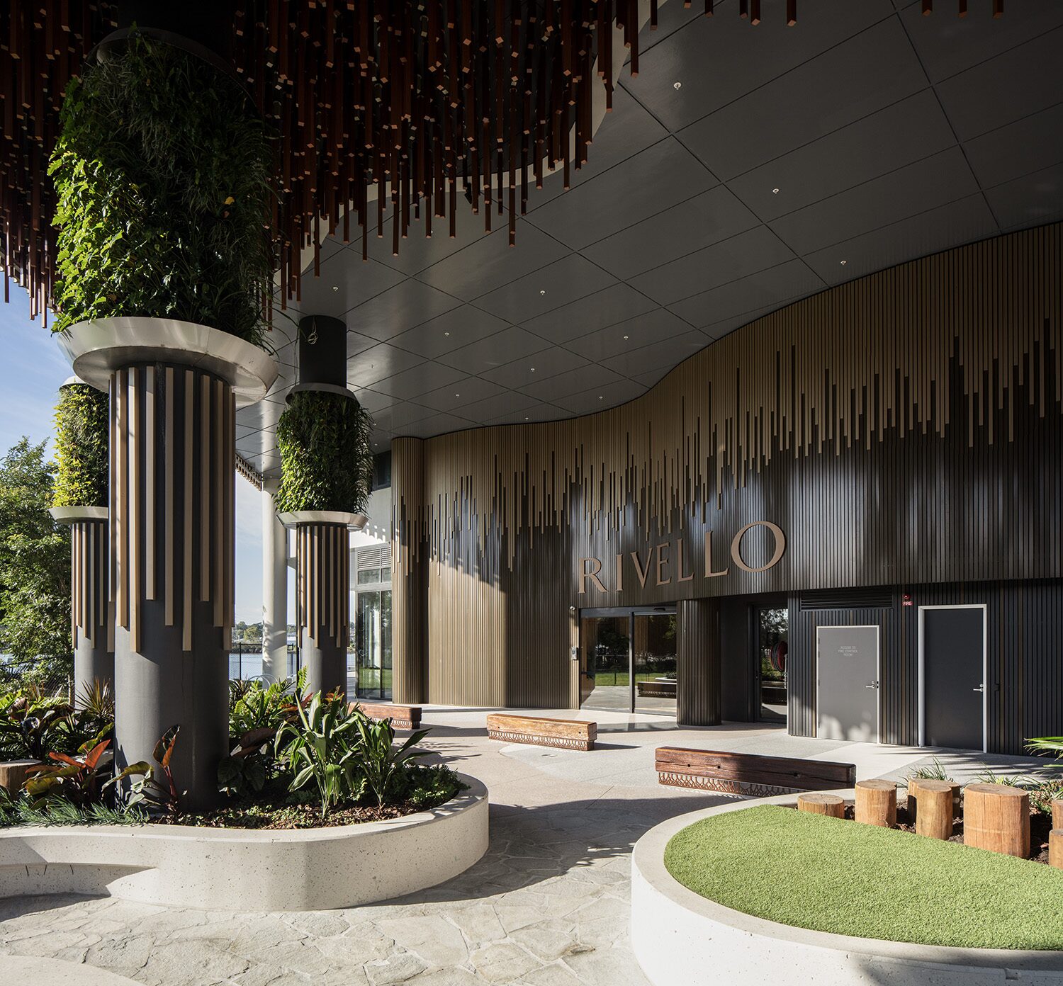 Rivello Residences — entrance lobby, signage and landscaped courtyard