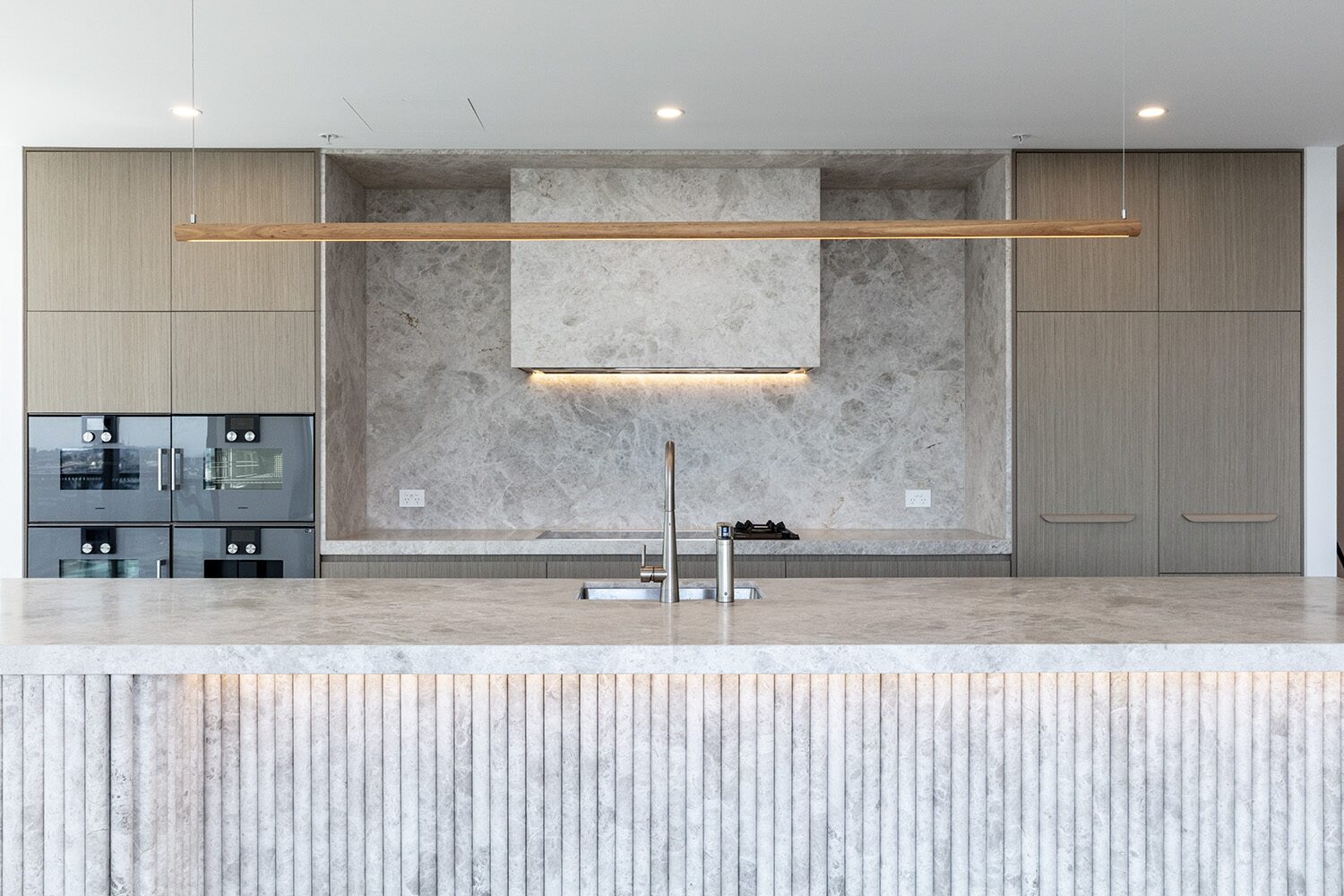 Rivello Residences — kitchen, pendant light and marble splashback