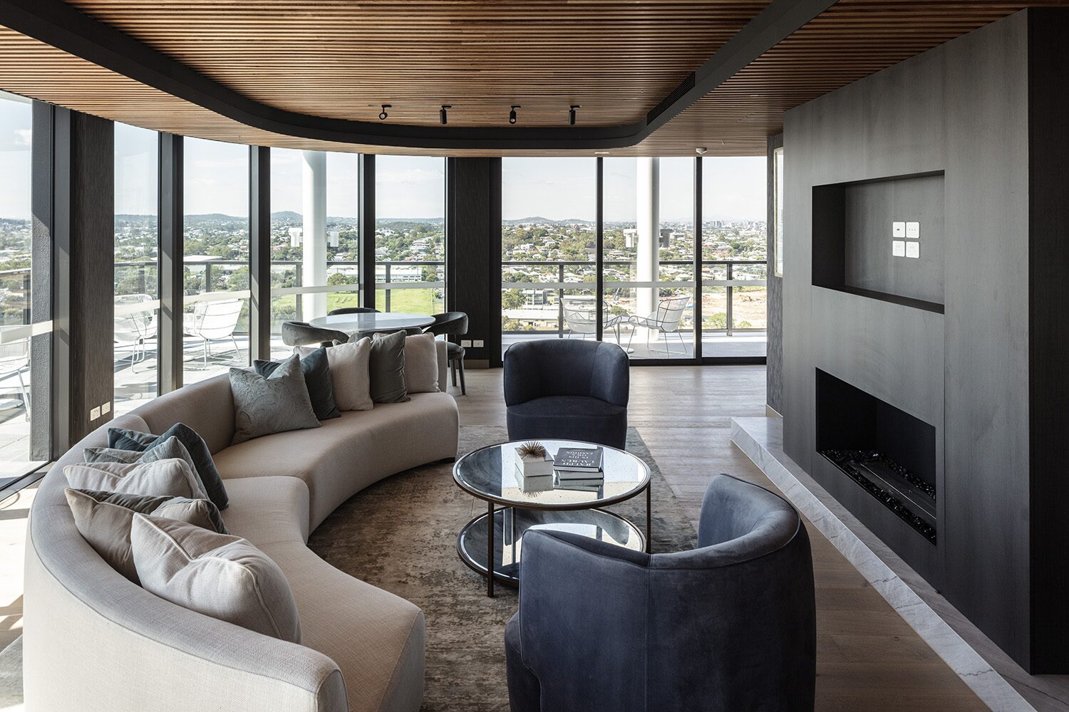 Rivello Residences — resident lounge, fireplace and city view