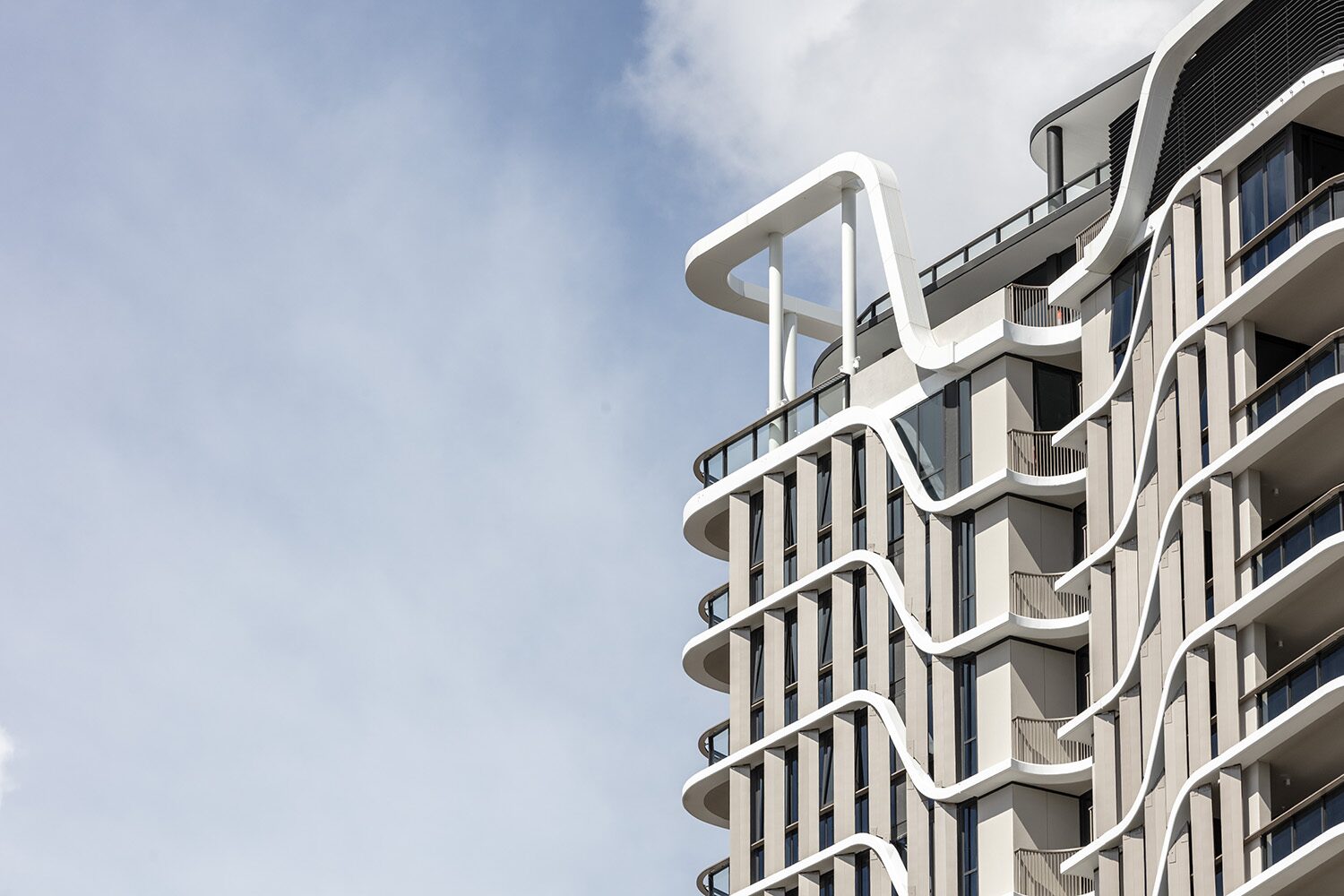 Rivello Residences — rooftop, sculptural balcony ribbon detail