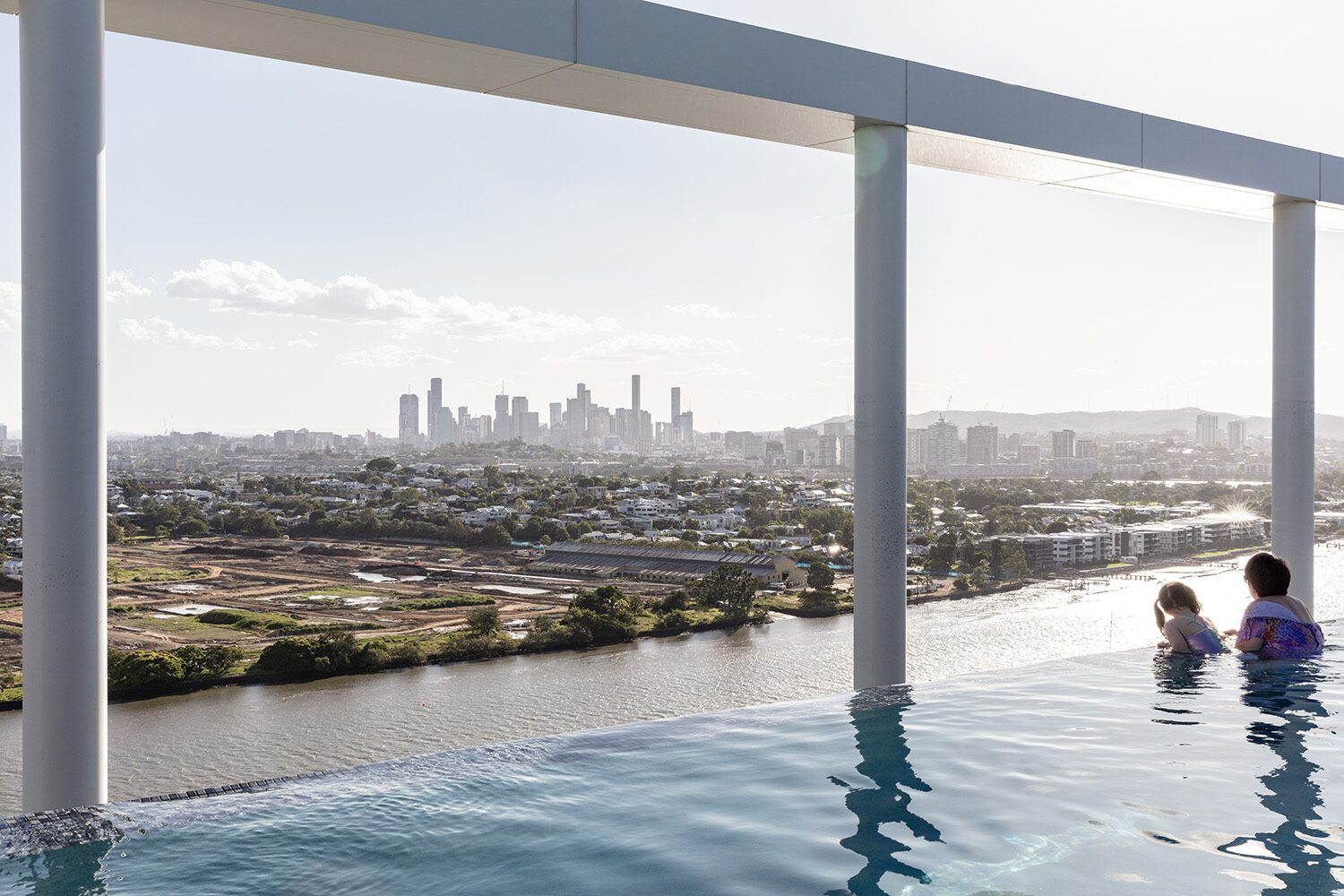 Rivello Residences — rooftop infinity pool, city skyline view