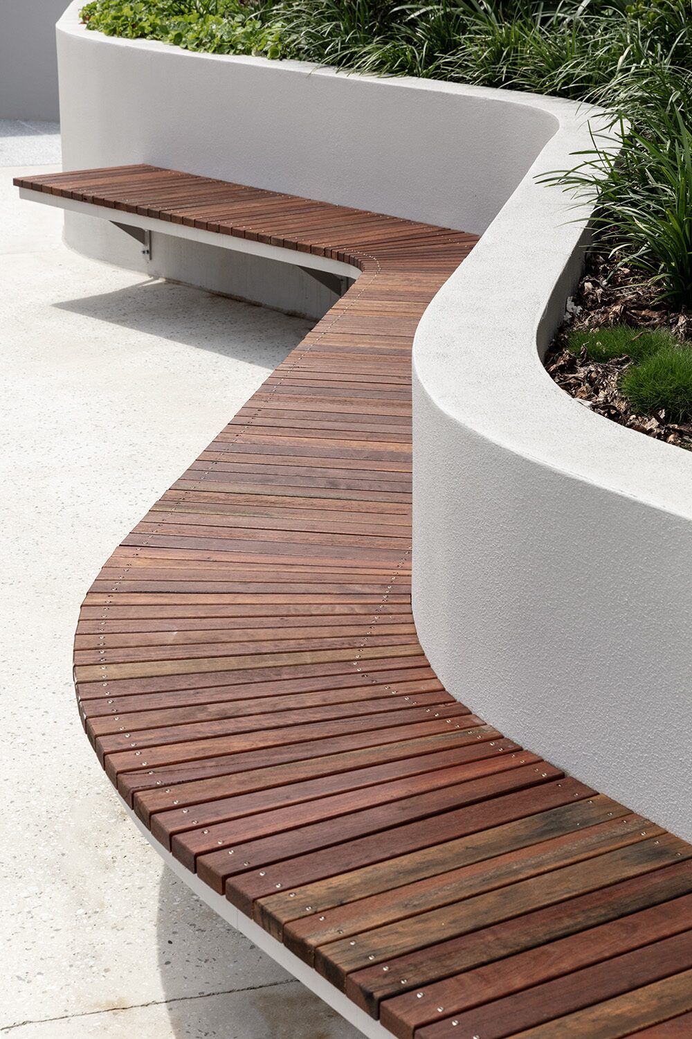 Rivello Residences — rooftop garden, curved timber bench detail