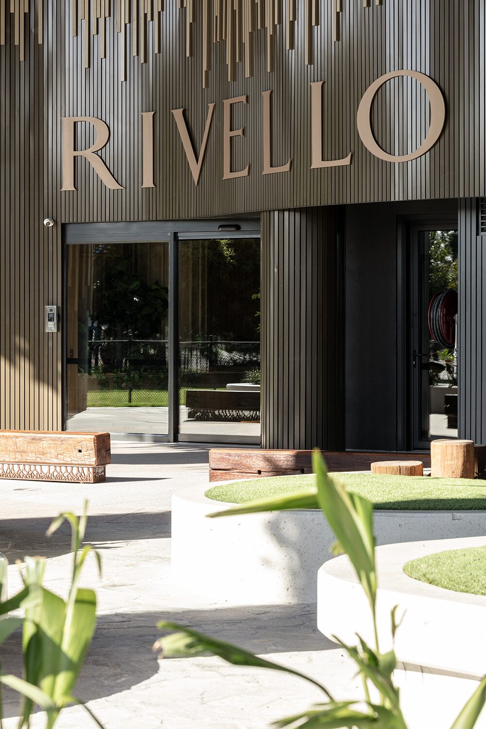 Rivello Residences — Rivello signage on the timber batten facade