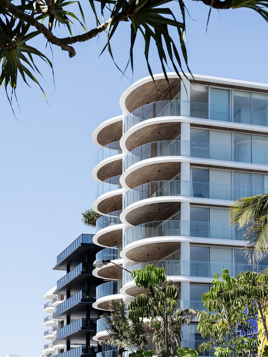 Rockpool — exterior, curved timber-lined balconies